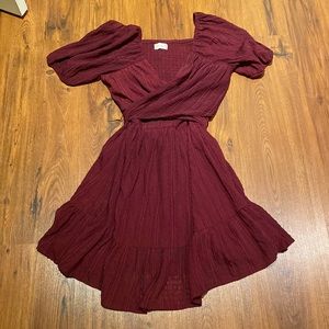lightly used maroon criss cross bubble sleeve elastic back peplum tie back mini